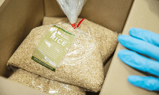 Rice packed in a box from Oshkosh Corporation's Feed the Body, Feed the Soul event