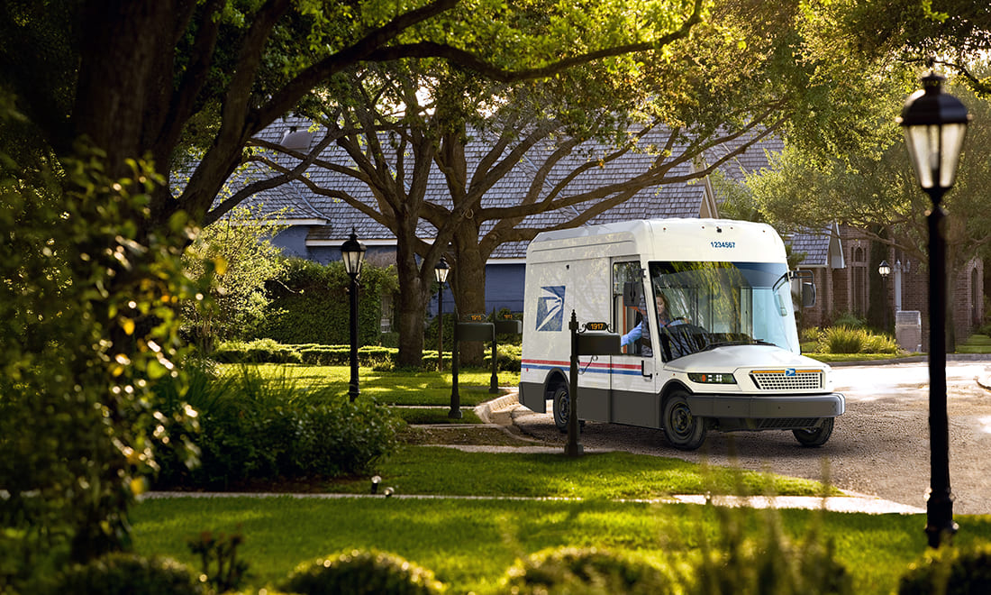 White USPS Next Generation Delivery Vehicle in a neighborhood