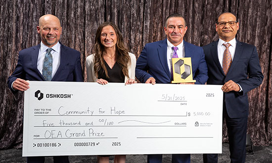 Team members accepting Oshkosh Excellence Award