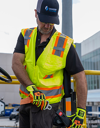 Oshkosh AeroTech team member in safety vest