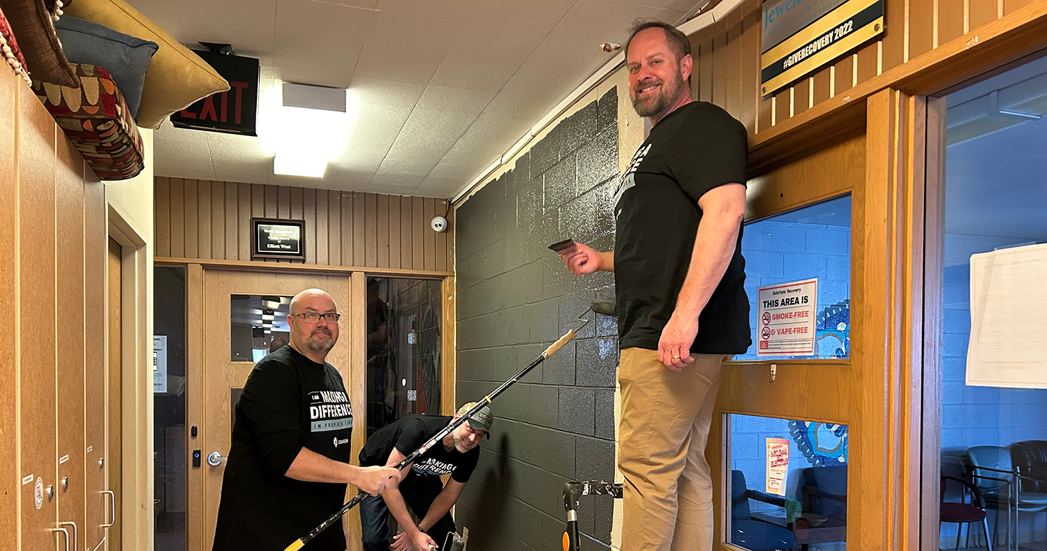  Team members painting at Solutions Recovery
